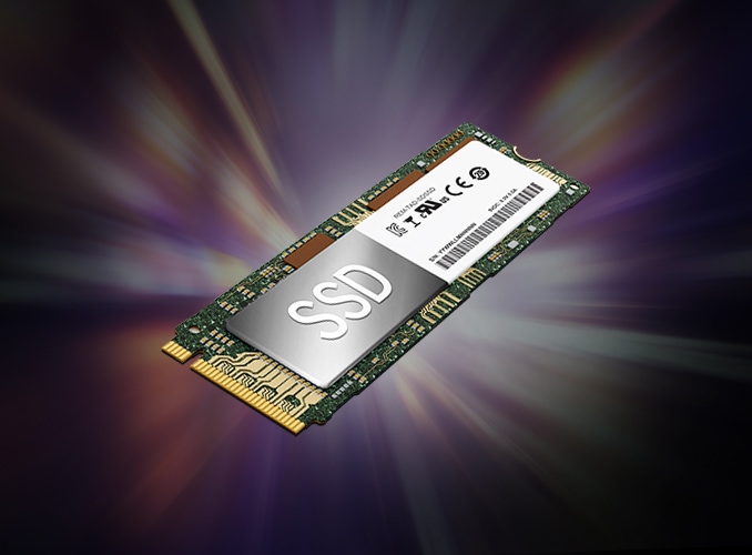 SSD가 중앙에 위치한 이미지로, SSD는 전자 회로 기판 위에 장착되어 있습니다. 배경은 다양한 색상의 빛이 퍼져 나가는 형태로, 역동적인 느낌을 줍니다. SSD 표면에는 SSD라는 텍스트가 크게 쓰여 있으며, 옆에는 여러 인증 마크와 바코드가 보입니다.