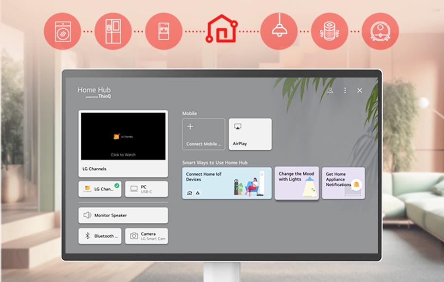 이미지에는 'Home Hub powered by ThinQ'라는 텍스트가 표시된 화면이 있습니다. 화면에는 LG Channels, PC USB-C, Monitor Speaker, Bluetooth, Camera LG Smart Cam 등의 옵션이 나열되어 있습니다. 'Click to Watch'라는 문구와 함께 LG Channels가 강조되어 있습니다. 모바일 연결을 위한 'Connect Mobile'과 'AirPlay' 버튼이 있으며, 'Smart Ways to Use Home Hub'라는 제목 아래 'Connect Home Io