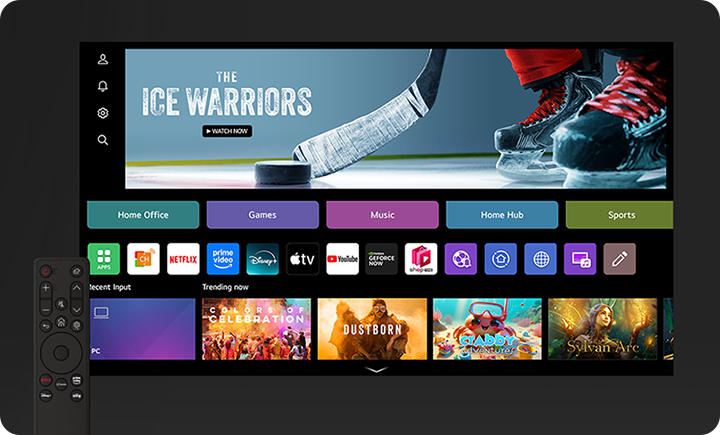 TV 화면에는 THE ICE WARRIORS라는 텍스트와 함께 아이스하키 스틱과 스케이트가 보입니다. 화면 아래에는 Home Office, Games, Music, Home Hub, Sports 등의 메뉴가 있습니다. 여러 앱 아이콘이 나열되어 있으며, CH, Netflix, Prime Video, Disney+, YouTube 등이 포함되어 있습니다. 하단에는 Recent Input과 Trending now 섹션이 있으며, 다양한 콘텐츠의 이미지가 표시되어 있습니다. 화면 왼쪽에는 리모컨이 보입니다.