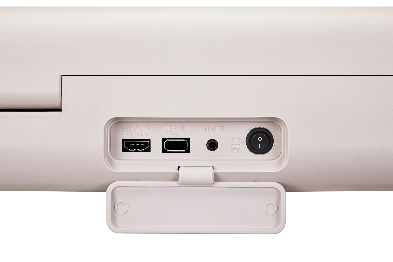 베이지색 장치의 포트 패널이 보입니다. HDMI IN (eARC/ARC), USB IN, IR BLASTER 포트가 있으며, 배터리 전원 스위치가 있습니다. 하단에는 덮개가 열려 있고, 덮개 안쪽에 27LX50과 MC070820 등의 텍스트가 있습니다.