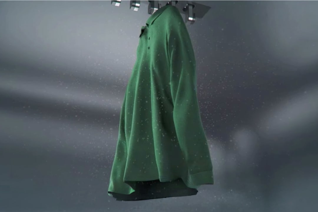 다이내믹 무빙행어를 통해 스타일러 내부의 초록색 옷이 흔들리고 있습니다. 주변에는 먼지가 털어져나가는 듯한 흰 가루가 같이 보여집니다.