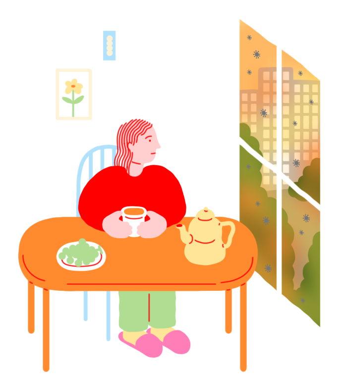 창가에 앉아 차를 마시는 여성이 미세먼지가 낀 도시 풍경을 바라보고 있다.