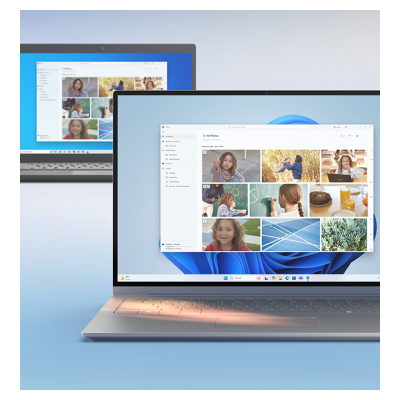 두 대의 노트북이 보이며, 전면의 노트북 화면에는 사진 갤러리 창이 열려 있다. 새로운 인터페이스와 개선된 작업 효율성을 나타내는 장면.